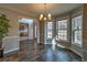 Dining room with hardwood floors, chandelier, and large windows at 2234 Oak Falls Ln, Buford, GA 30519