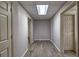 Hallway in finished basement featuring modern flooring and multiple doorways at 2234 Oak Falls Ln, Buford, GA 30519