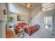 Spacious living room with soaring ceilings, a cozy fireplace, and staircase leading to the second floor at 2234 Oak Falls Ln, Buford, GA 30519