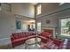Inviting living room featuring high ceilings, fireplace, large windows, and an open floor plan at 2234 Oak Falls Ln, Buford, GA 30519