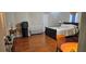 Bedroom features hardwood floors, a comfortable bed, and neutral walls at 3715 Millers Pond Way, Snellville, GA 30039