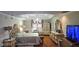 Large bedroom boasts a bed, tray ceiling, hardwood floors, and luxury furnishings at 3715 Millers Pond Way, Snellville, GA 30039