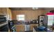 Functional kitchen features stainless steel appliances, tile backsplash, and ample cabinet space at 3715 Millers Pond Way, Snellville, GA 30039
