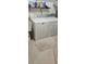 Laundry room with washer, dryer, utility sink, and shelf storage at 3715 Millers Pond Way, Snellville, GA 30039