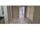 Open living room features neutral colors, windows and access to the front door at 3715 Millers Pond Way, Snellville, GA 30039