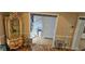Living room featuring ornate furniture, hardwood floors, and decorative beaded doorway leading to the staircase at 3715 Millers Pond Way, Snellville, GA 30039