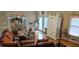 View of living room with leather sofa, hardwood floors, and a dining area view at 3715 Millers Pond Way, Snellville, GA 30039
