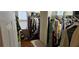A walk-in closet features shelving and storage for clothes and shoes at 3715 Millers Pond Way, Snellville, GA 30039