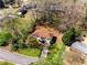 Aerial view showcasing a charming home with a long driveway and inviting curb appeal in a quiet, established neighborhood at 3844 Rena Se Ln, Smyrna, GA 30082