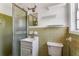 Bathroom featuring a shower, toilet, sink, and window at 3844 Rena Se Ln, Smyrna, GA 30082