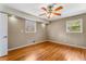 Bedroom with hardwood flooring, natural light, and a ceiling fan at 3844 Rena Se Ln, Smyrna, GA 30082