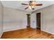 Bedroom with hardwood floors, ceiling fan, and closet at 3844 Rena Se Ln, Smyrna, GA 30082