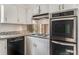 Functional kitchen featuring white cabinets, stainless steel appliances, and granite countertops at 3844 Rena Se Ln, Smyrna, GA 30082