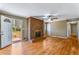 Spacious living room with a striking brick fireplace and access to the backyard through a white door at 3844 Rena Se Ln, Smyrna, GA 30082