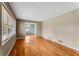 Bright living room with hardwood floors and a large window, offering a view to the adjacent dining room at 3844 Rena Se Ln, Smyrna, GA 30082