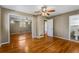 Large primary bedroom with hardwood floors and mirrored closet doors at 3844 Rena Se Ln, Smyrna, GA 30082