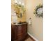 Powder room featuring a dark vanity with marble countertop at 3858 Fenway Xing, Marietta, GA 30062