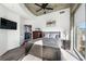 Bright bedroom with exposed concrete ceiling, large window, mounted TV, and walk-in closet at 400 W Peachtree Nw St # 2011, Atlanta, GA 30308