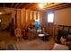 Unfinished basement area with exposed wood beams, open studs, and single window at 4288 Wyndham Park Cir, Decatur, GA 30034