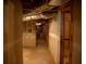 Unfinished basement hallway with exposed ceiling and partially finished walls at 4288 Wyndham Park Cir, Decatur, GA 30034