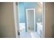 Classic bathroom with white cabinets, blue wallpaper, and a separate tub and shower area at 4288 Wyndham Park Cir, Decatur, GA 30034