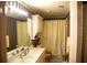 Well-lit bathroom features a vanity with mirror, floral wallpaper and shower with yellow curtain at 4288 Wyndham Park Cir, Decatur, GA 30034
