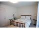 Bright bedroom featuring a full bed, glass table and a neutral color palette at 4288 Wyndham Park Cir, Decatur, GA 30034