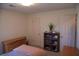 Functional bedroom featuring a full bed, wood dresser, and plenty of storage space at 4288 Wyndham Park Cir, Decatur, GA 30034