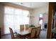 Bright dining room features a chandelier, large window, and table with seating for six at 4288 Wyndham Park Cir, Decatur, GA 30034