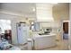 Well-lit kitchen featuring an island with cooktop, ample cabinetry, and modern appliances at 4288 Wyndham Park Cir, Decatur, GA 30034