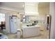 Well-lit kitchen featuring an island with cooktop, ample cabinetry, and modern appliances at 4288 Wyndham Park Cir, Decatur, GA 30034