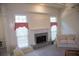 Cozy living room showcases a fireplace, natural light from windows, and neutral decor at 4288 Wyndham Park Cir, Decatur, GA 30034