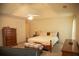 Spacious main bedroom with a tray ceiling, neutral color scheme, and classic furnishings at 4288 Wyndham Park Cir, Decatur, GA 30034