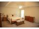 Spacious main bedroom with a tray ceiling, neutral color scheme, and classic furnishings at 4288 Wyndham Park Cir, Decatur, GA 30034