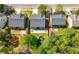 Aerial view of residential houses featuring well-maintained roofs and backyards at 515 Quinn Dr, Woodstock, GA 30188
