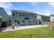 Spacious backyard featuring a patio, grassy area, and privacy fencing perfect for entertaining at 515 Quinn Dr, Woodstock, GA 30188