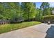 Large backyard with trampoline, playset, and patio area at 515 Quinn Dr, Woodstock, GA 30188