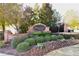 Community entrance sign with brick pillars and lush landscaping at 515 Quinn Dr, Woodstock, GA 30188