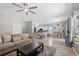 Open-concept living area with wood floors, neutral tones, modern lighting, and a comfortable sofa at 515 Quinn Dr, Woodstock, GA 30188