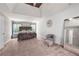 Spacious main bedroom with vaulted ceiling, accent wall, large windows and seating area at 515 Quinn Dr, Woodstock, GA 30188