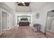 Bright main bedroom featuring a vaulted ceiling, large windows and a comfortable seating area at 515 Quinn Dr, Woodstock, GA 30188