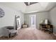 Main bedroom with a vaulted ceiling, shiplap accent wall, seating area, and access to the ensuite bathroom at 515 Quinn Dr, Woodstock, GA 30188