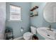 Charming powder room featuring sleek fixtures, wooden shelves and a modern vessel sink at 515 Quinn Dr, Woodstock, GA 30188