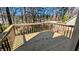 Outdoor deck perfect for entertaining with wood railings and partial shade at 831 Stonebrook Dr, Lithonia, GA 30058