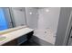 Neutral bathroom featuring a tub and vanity with ample counter space at 831 Stonebrook Dr, Lithonia, GA 30058