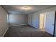 Spacious bedroom featuring carpet flooring and multiple entryways at 831 Stonebrook Dr, Lithonia, GA 30058