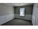 Bedroom with carpet, wainscoting, and natural light from one window at 831 Stonebrook Dr, Lithonia, GA 30058