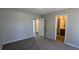 View of a bedroom with carpet and access to other rooms at 831 Stonebrook Dr, Lithonia, GA 30058