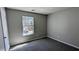 Bedroom with carpet and view of a vehicle outside the window at 831 Stonebrook Dr, Lithonia, GA 30058