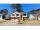 Charming two-story home featuring a well-maintained lawn, a two-car garage, and appealing curb appeal at 831 Stonebrook Dr, Lithonia, GA 30058